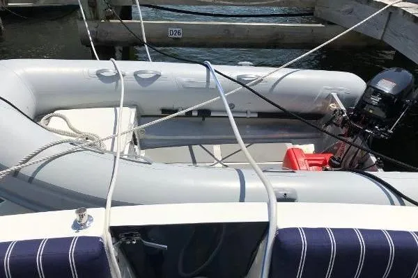  Yacht Photos Pics Inflatable dinghy on 2018 Back Cove Downeast 37 boat, docked with ropes and motor.