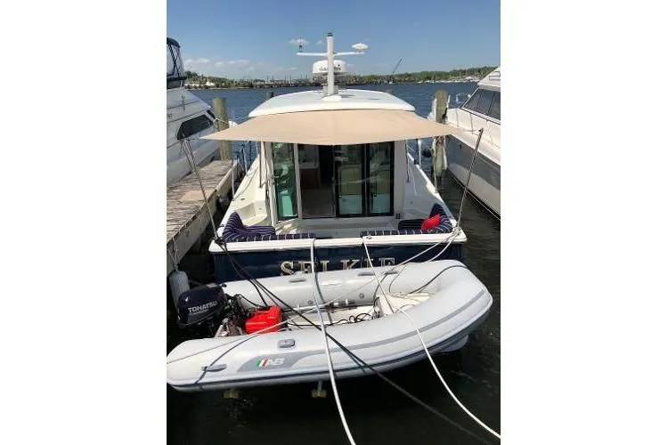  Yacht Photos Pics 2018 Back Cove Downeast 37 docked with inflatable boat attached.