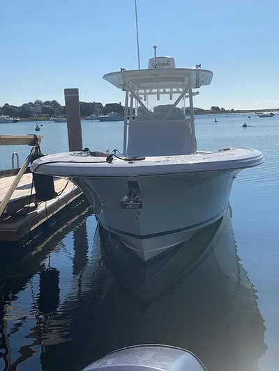  Yacht Photos Pics 2016 Buddy Davis 28 Center Console boat docked in calm waters.