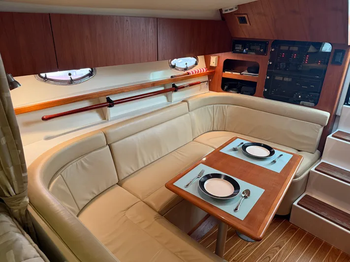 Awol Yacht Photos Pics Luxurious 2003 Tiara Yachts 3100 Open LE interior with elegant dining area and plush seating.