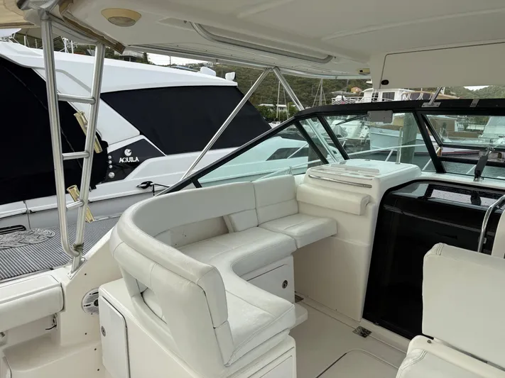 Awol Yacht Photos Pics 2003 Tiara Yachts 3100 Open LE interior with white seating and helm station.