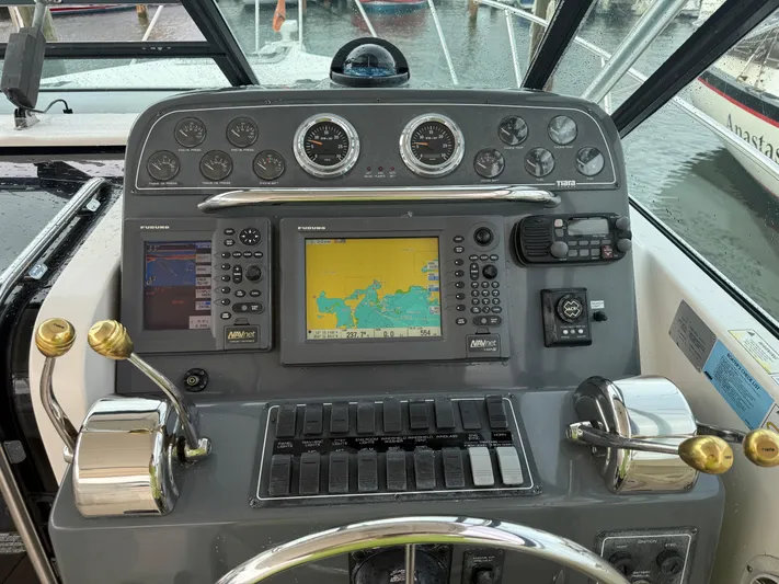 Awol Yacht Photos Pics 2003 Tiara Yachts 3100 Open LE dashboard with navigation and control systems.