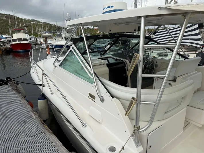 Awol Yacht Photos Pics 2003 Tiara Yachts 3100 Open LE docked at marina, showcasing sleek design and spacious cockpit.