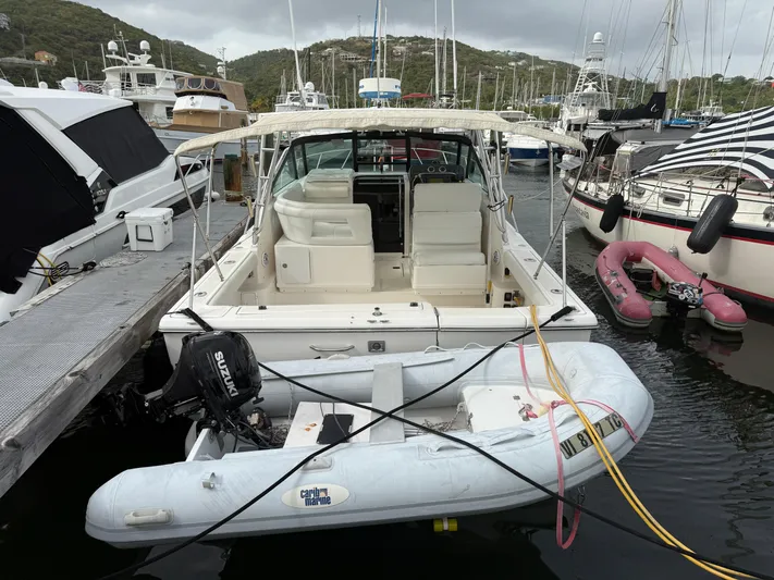 Awol Yacht Photos Pics 2003 Tiara Yachts 3100 Open LE docked with inflatable dinghy attached.