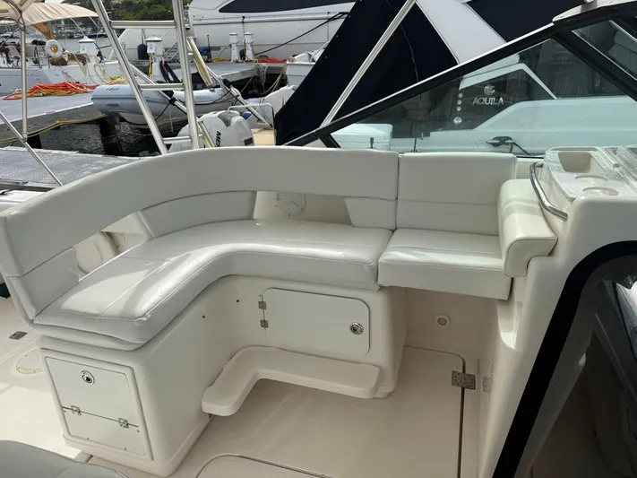 Awol Yacht Photos Pics 2003 Tiara Yachts 3100 Open LE interior with white seating and storage compartments.