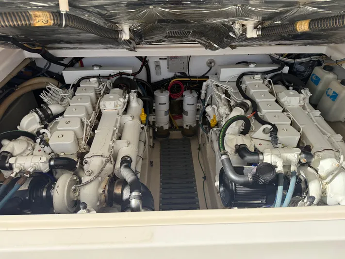 Awol Yacht Photos Pics Engine compartment of a 2003 Tiara Yachts 3100 Open LE, showcasing dual engines and components.