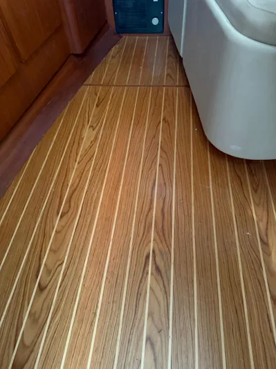 Awol Yacht Photos Pics Teak flooring on 2003 Tiara Yachts 3100 Open LE, showcasing elegant wood grain.