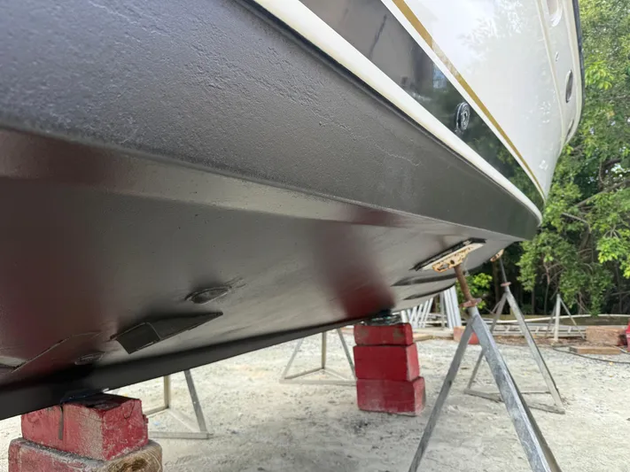 Awol Yacht Photos Pics 2003 Tiara Yachts 3100 Open LE hull on dry dock, supported by stands.