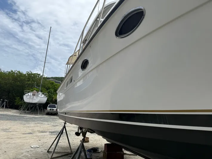 Awol Yacht Photos Pics 2003 Tiara Yachts 3100 Open LE on stands, with another boat in the background.