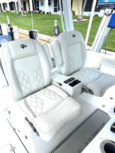 Yacht Photos Pics 2022 Sea Pro 320 DLX Center Console with luxurious white seating and modern design.