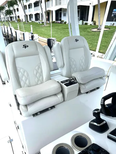  Yacht Photos Pics 2022 Sea Pro 320 DLX Center Console with luxurious seating and modern controls.