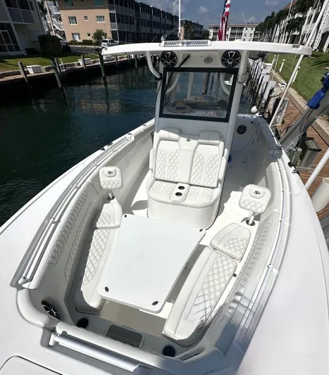  Yacht Photos Pics 2022 Sea Pro 320 DLX Center Console boat docked, featuring spacious seating and modern design.