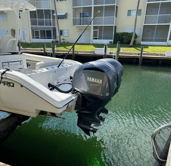  Yacht Photos Pics 2022 Sea Pro 320 DLX Center Console with Yamaha outboard engine docked by waterfront.