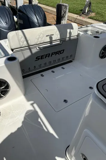  Yacht Photos Pics 2022 Sea Pro 320 DLX Center Console boat interior with seating and storage.