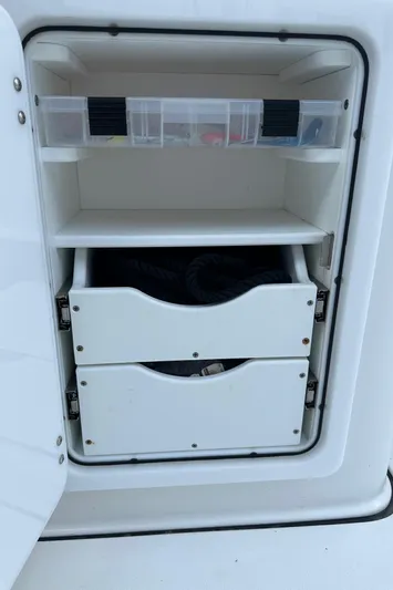  Yacht Photos Pics Storage compartment on a 2022 Sea Pro 320 DLX Center Console boat with shelves and drawers.