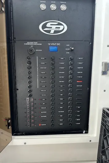  Yacht Photos Pics Control panel of 2022 Sea Pro 320 DLX Center Console boat, featuring 12-volt DC switches.