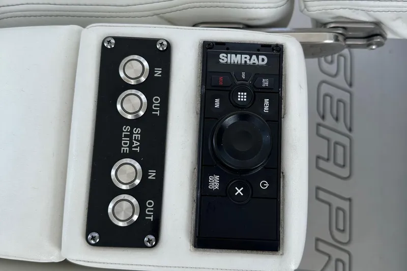  Yacht Photos Pics Control panel of 2022 Sea Pro 320 DLX Center Console with Simrad system and seat adjustment.