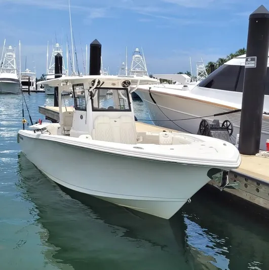  Yacht Photos Pics 2022 Sea Pro 320 DLX Center Console boat docked in a marina.