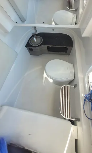  Yacht Photos Pics 2022 Sea Pro 320 DLX Center Console boat interior with sink and toilet.