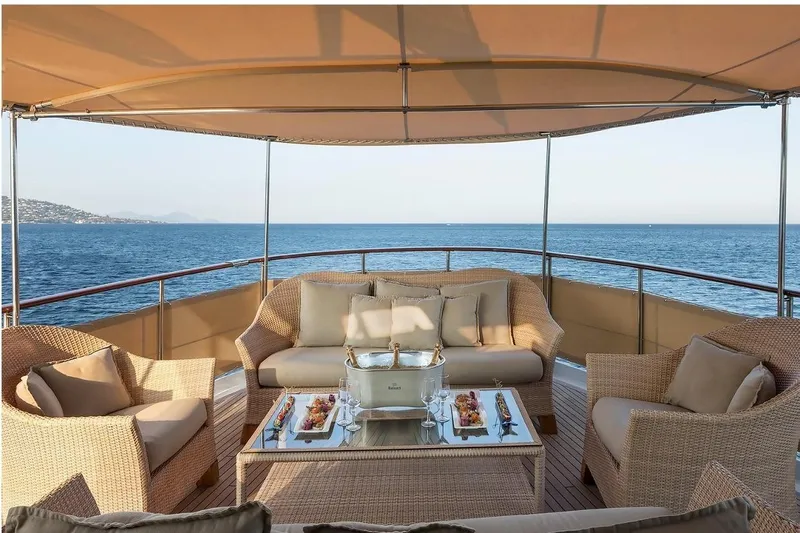 Le Kir Royal Yacht Photos Pics Luxurious 1966 Full Displacement Motor Yacht deck with elegant seating and ocean view.