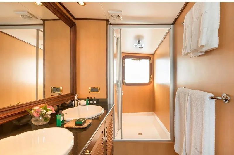 Le Kir Royal Yacht Photos Pics Luxurious 1966 Full Displacement Motor Yacht bathroom with dual sinks and shower.