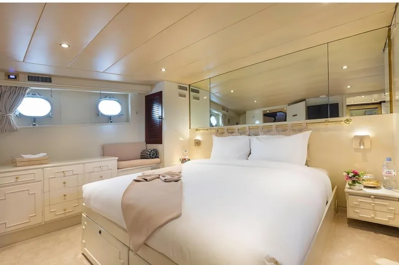 Le Kir Royal Yacht Photos Pics Luxurious 1966 Full Displacement Motor Yacht bedroom with elegant decor and cozy bedding.