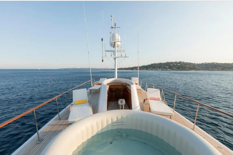 Le Kir Royal Yacht Photos Pics Luxurious 1966 Full Displacement Motor Yacht with deck jacuzzi and sun loungers at sea.