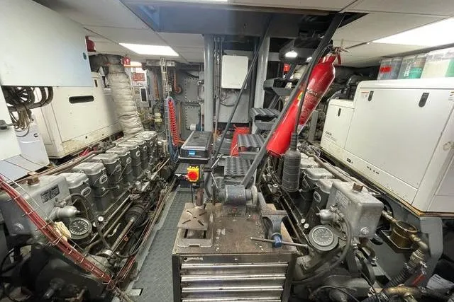 Le Kir Royal Yacht Photos Pics Engine room of a 1966 Van den Akker Displacement yacht, featuring machinery and equipment.
