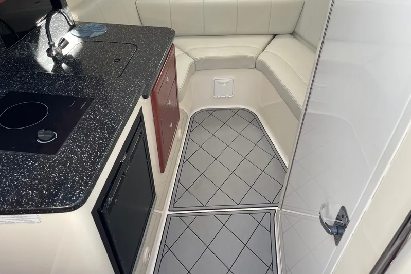 Roweboat Yacht Photos Pics Interior of 2010 Concept 4400 Sport Yacht with modern kitchen and seating area.