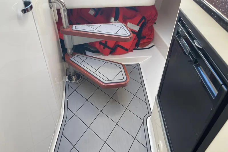 Roweboat Yacht Photos Pics Interior of 2010 Concept 4400 Sport Yacht with steps and life jackets.