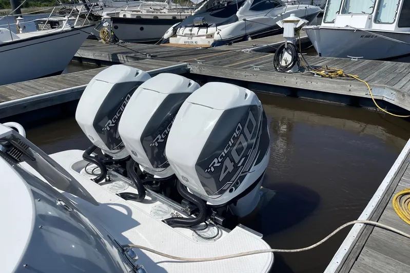 Roweboat Yacht Photos Pics 2010 Concept 4400 Sport Yacht with triple Racing 400 outboard engines at marina dock.