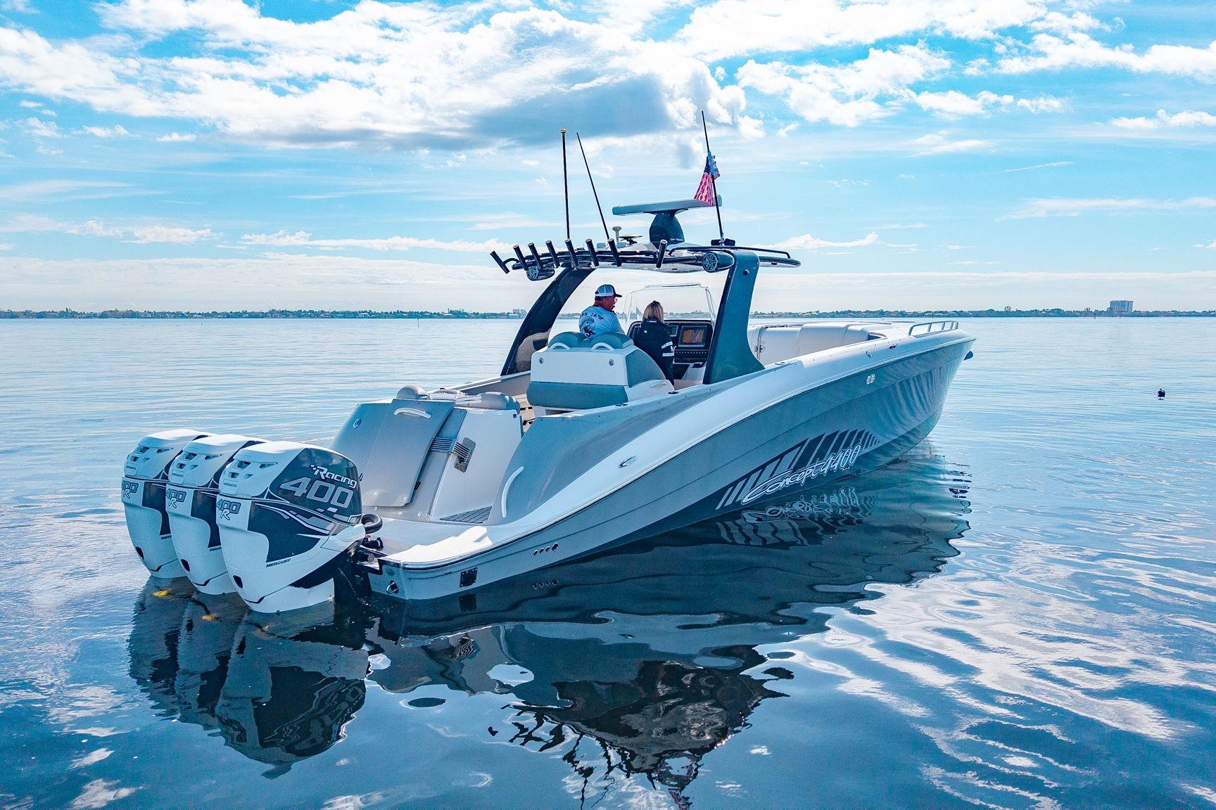 2010 Concept 4400 Sport Yacht cruising on calm waters under a clear blue sky.