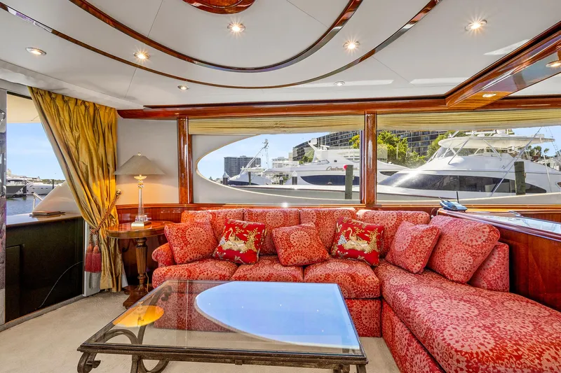 Touch The Sun Yacht Photos Pics Luxurious interior of 2004 Lazzara 80 SL yacht with plush red seating and elegant decor.