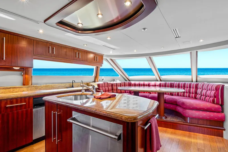 Touch The Sun Yacht Photos Pics Luxurious interior of 2004 Lazzara 80 SL yacht with ocean view and elegant wood finishes.