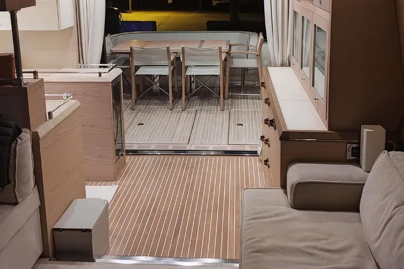  Yacht Photos Pics Luxurious interior of 2015 Beneteau Monte Carlo 6 yacht with elegant dining area.