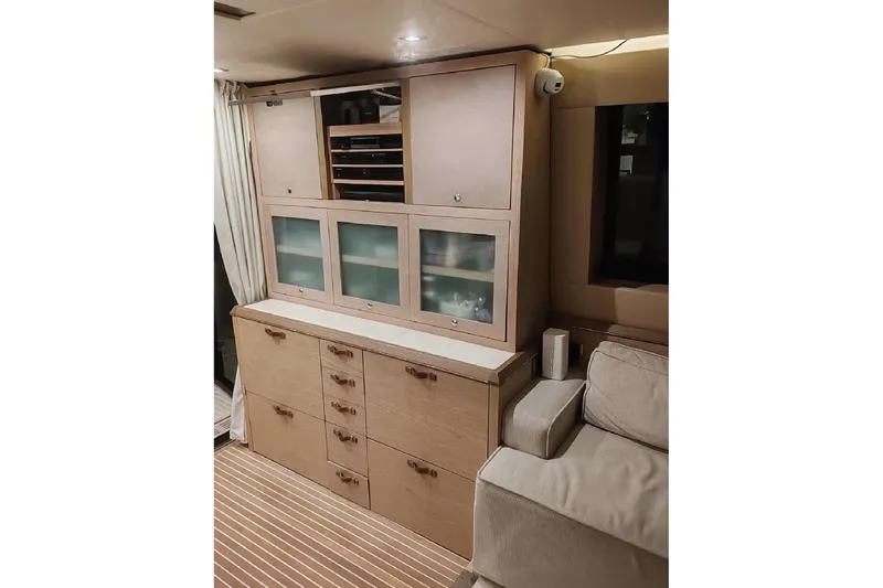  Yacht Photos Pics Interior of 2015 Beneteau Monte Carlo 6 yacht with wooden cabinetry and seating area.
