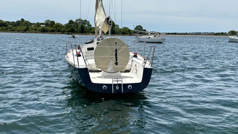 Seabird Yacht Photos Pics Sailing yacht J Boats J/95 (2012) on calm water, rear view.