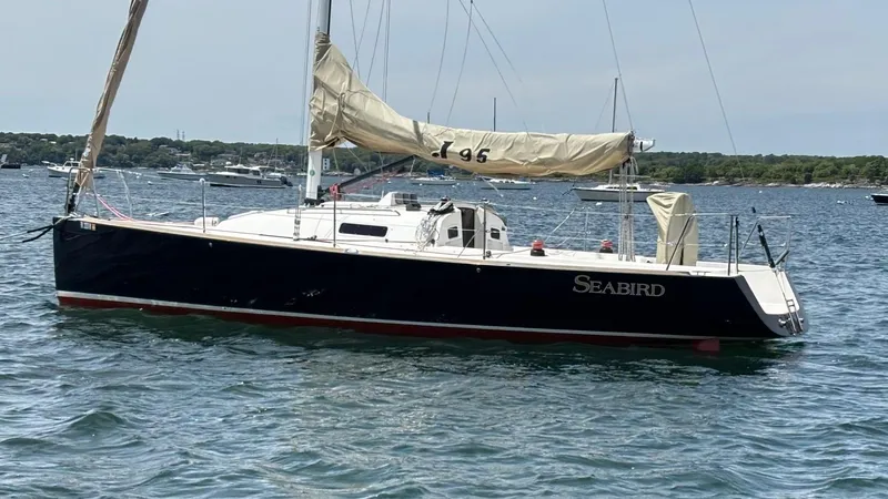 Seabird Yacht Photos Pics 2012 J Boats J/95 sailboat named "Seabird" on calm water.