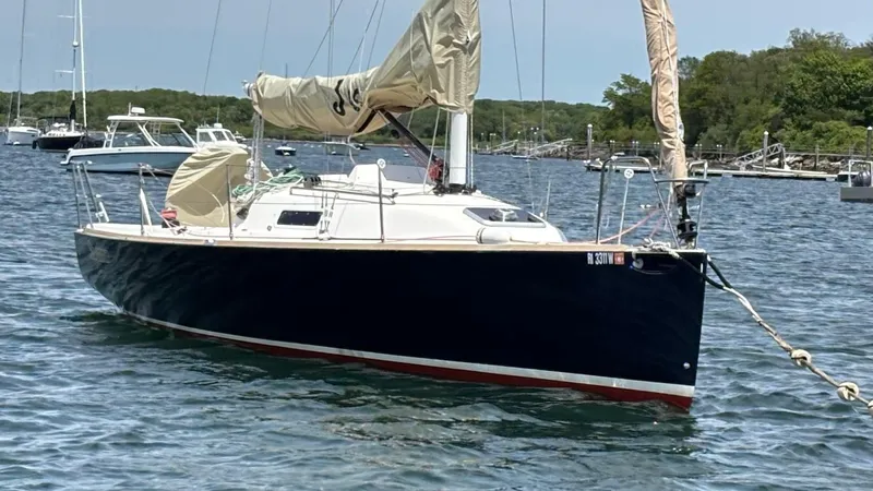 Seabird Yacht Photos Pics 2012 J Boats J/95 sailboat anchored in a calm harbor.