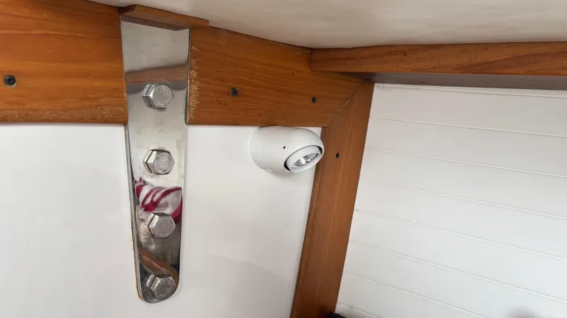 Seabird Yacht Photos Pics Interior view of 2012 J Boats J/95, featuring wooden beams and metal fittings.