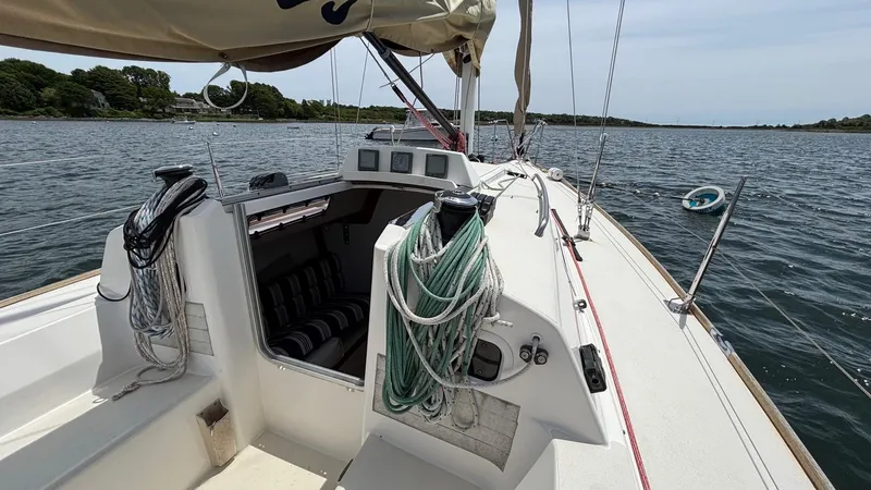 Seabird Yacht Photos Pics Sailboat J/95 from 2012 on calm waters, featuring a tidy cockpit and rigging.