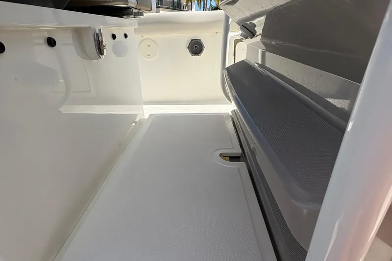  Yacht Photos Pics 2017 Boston Whaler 330 Outrage interior detail, showcasing sleek design and storage features.
