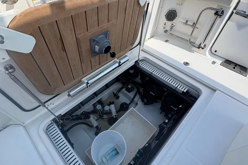  Yacht Photos Pics Open hatch of a 2017 Boston Whaler 330 Outrage, revealing internal components.