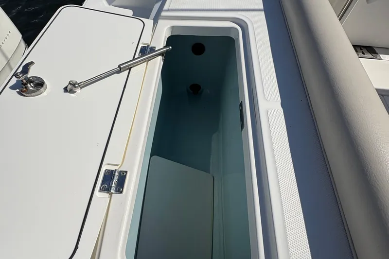  Yacht Photos Pics Open storage compartment on a 2017 Boston Whaler 330 Outrage boat.
