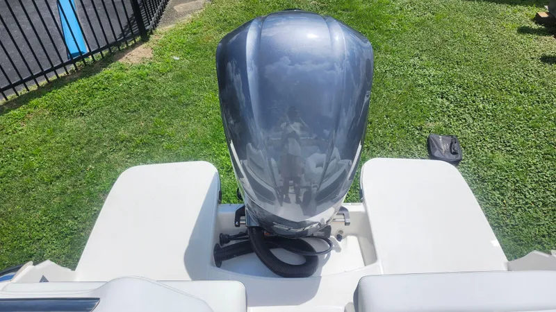  Yacht Photos Pics 2026 Regal LX4 boat engine on grassy background, viewed from above.