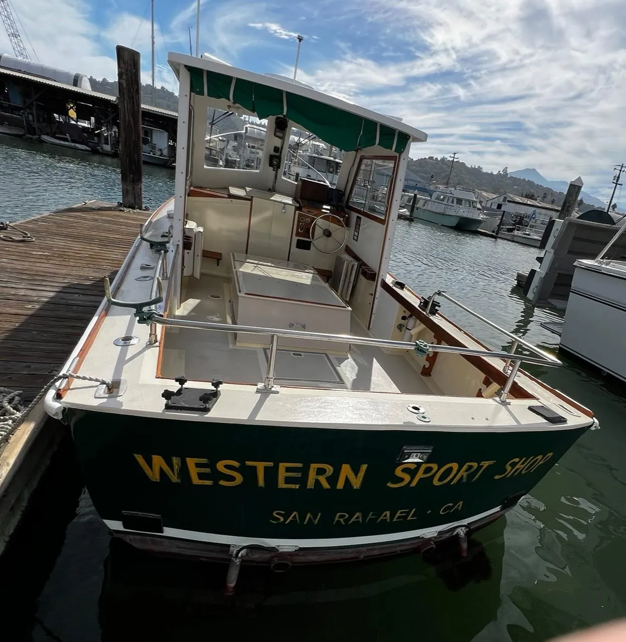 1974 Dyer 29' Sport Fisher boat docked at marina, San Rafael, CA.