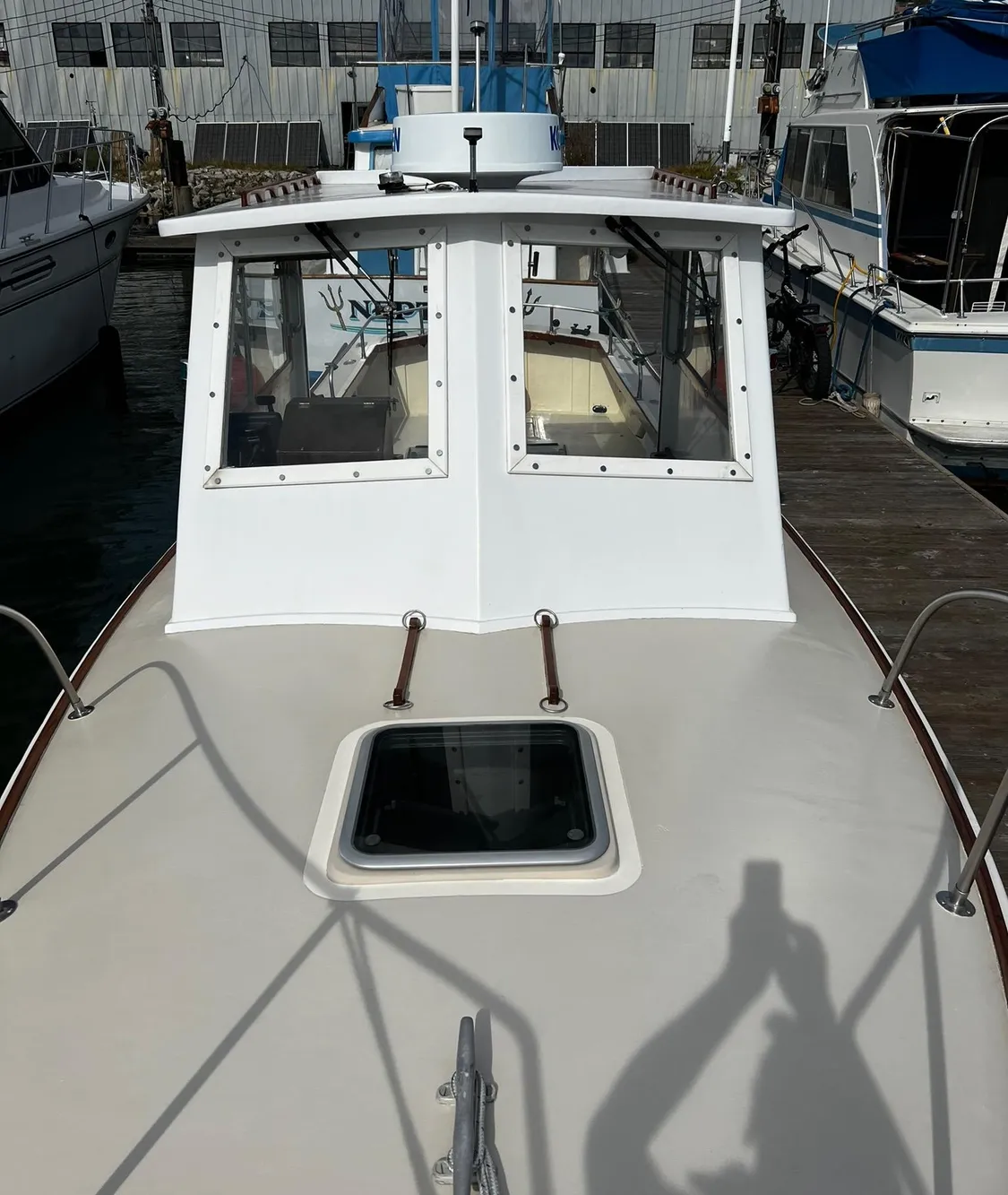 1974 Dyer 29' Sport Fisher boat docked, showcasing cabin and deck features.
