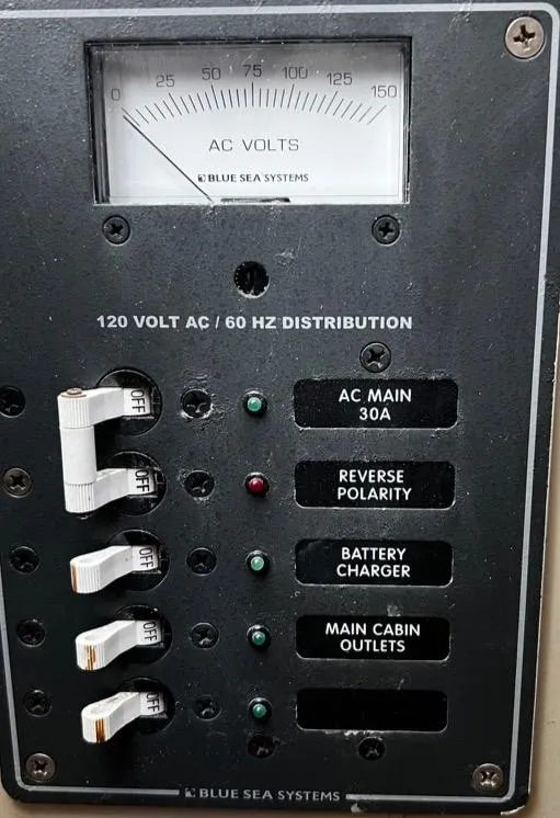 1974 Dyer 29' Sport Fisher electrical panel with AC voltmeter and circuit breakers.