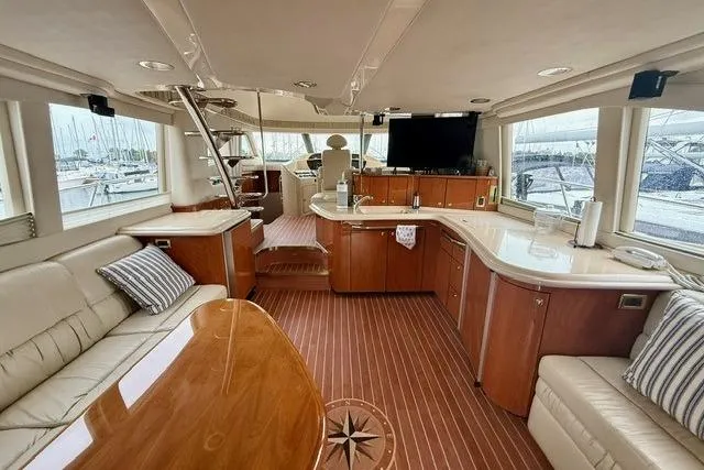  Yacht Photos Pics Luxurious interior of 2001 Sea Ray 540 Cockpit Motor Yacht with elegant wood finishes.