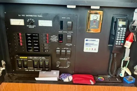  Yacht Photos Pics Control panel of a 2001 Sea Ray 540 Cockpit Motor Yacht with various switches and devices.